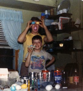 Most of the pictures that have me at our kitchen table were us coloring Easter Eggs. I like this one because you can see the radio on the shelf. Ignore my Beatles T-shirt. ;)